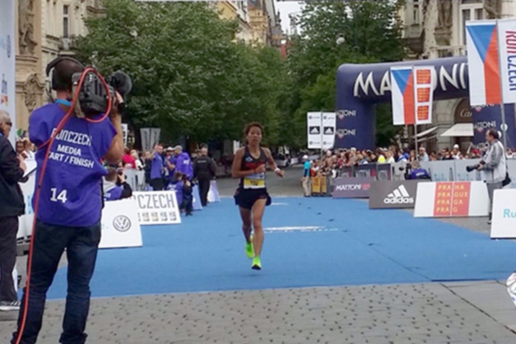 Hong Kong's rising star, Christy Yiu Kit-ching, about to cross the finish at the Prague marathon. Photo: Richard Castka