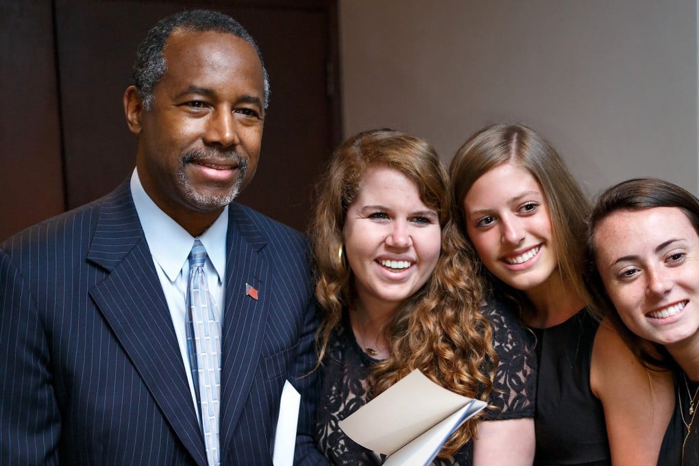Ben Carson poses with students after a speech at the Carolina Theatre in Greensboro, North Carolina, on Saturday. Photo: Washington Post