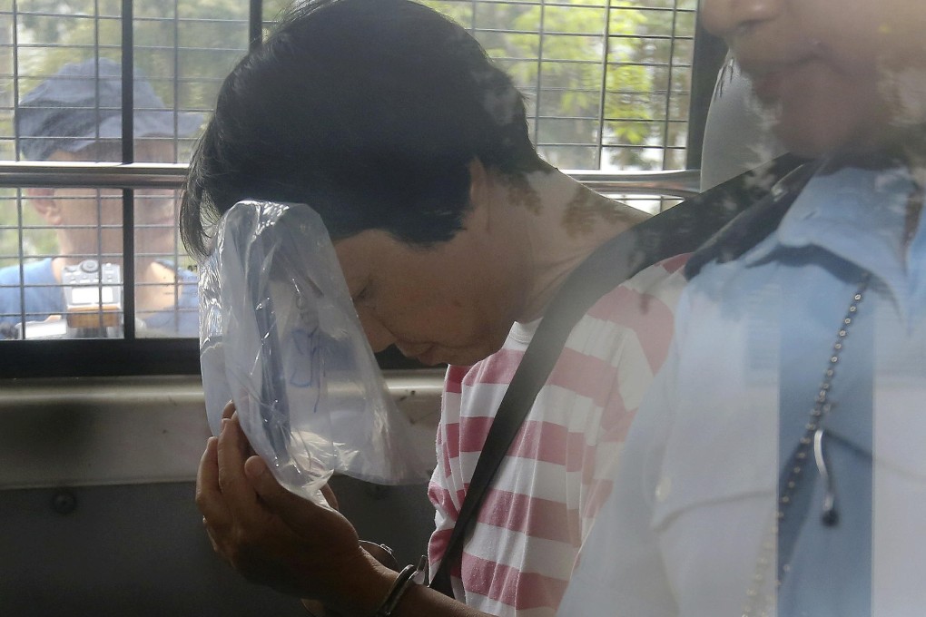 Taxi driver Sum Siu-fong at Tuen Mun Court yesterday. She allegedly kept a knife in her car and wore a bulletproof vest. Photo: SCMP Pictures