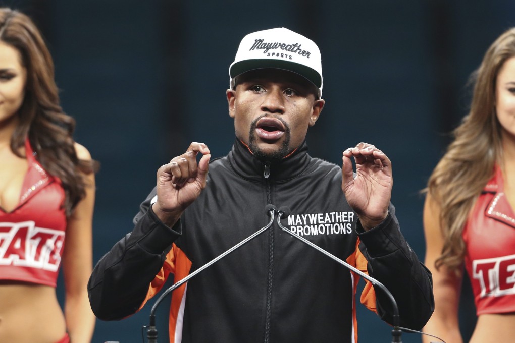 Floyd Mayweather attends a post-match press conference. Photo: EPA