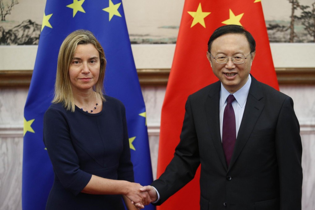 European Union foreign policy chief Federica Mogherini shakes hands with State Councillor Yang Jiechi in Beijing.Photo: AFP