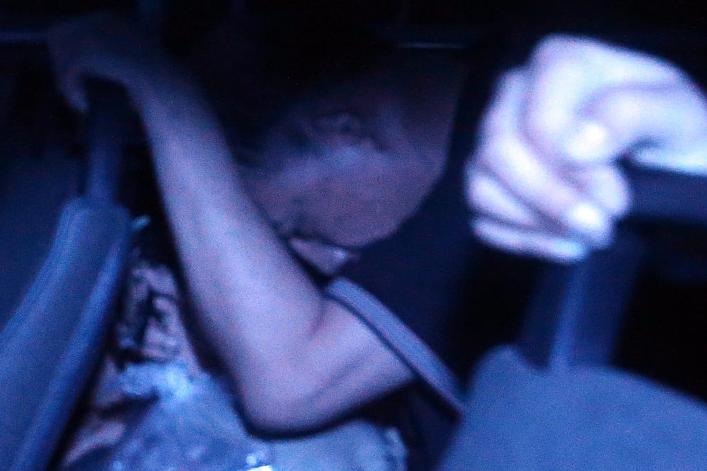 Private tutor Chan Tack-hing is taken away from court after being found guilty and sentenced to jail. Photo: K. Y. Cheng