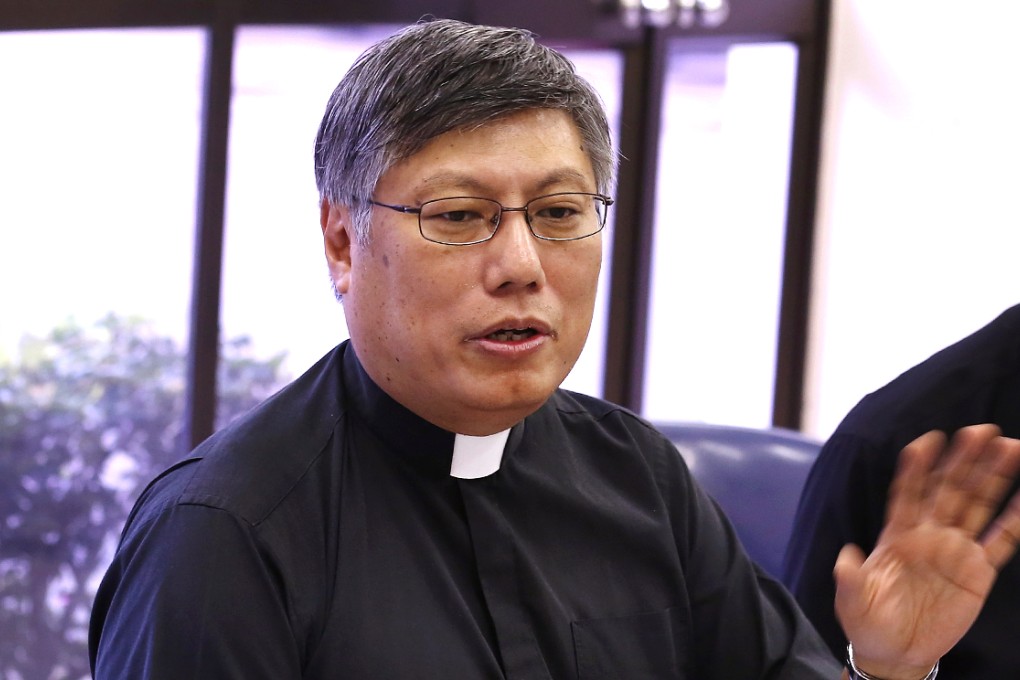 Father Stephen Chow Sau-yan, chairman of the taskforce, called for people not to make further financial donations to the project. Photo: Jonathan Wong