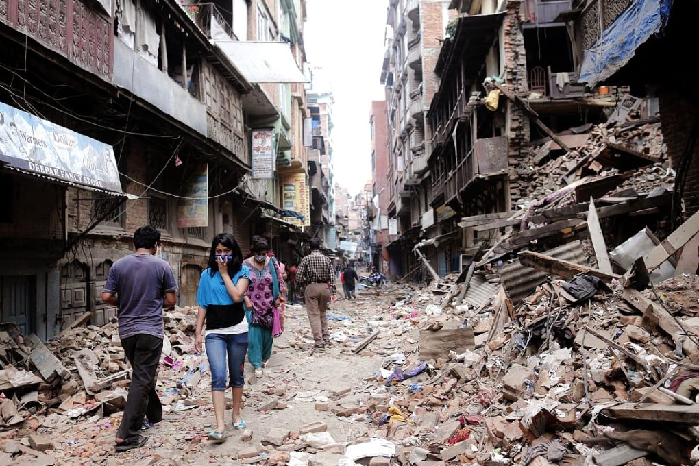 People walk through the devastated streets of Kathmandu, Nepal, in the wake of the earthquake last month that left 6,000 dead and thousands more unaccounted for. Photo: EPA