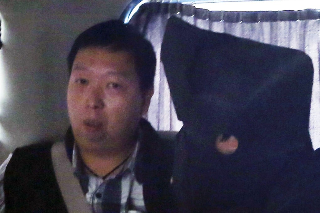 The unnamed man (right) was taken to Tsz Wan Shan police station yesterday. Photo: Sam Tsang