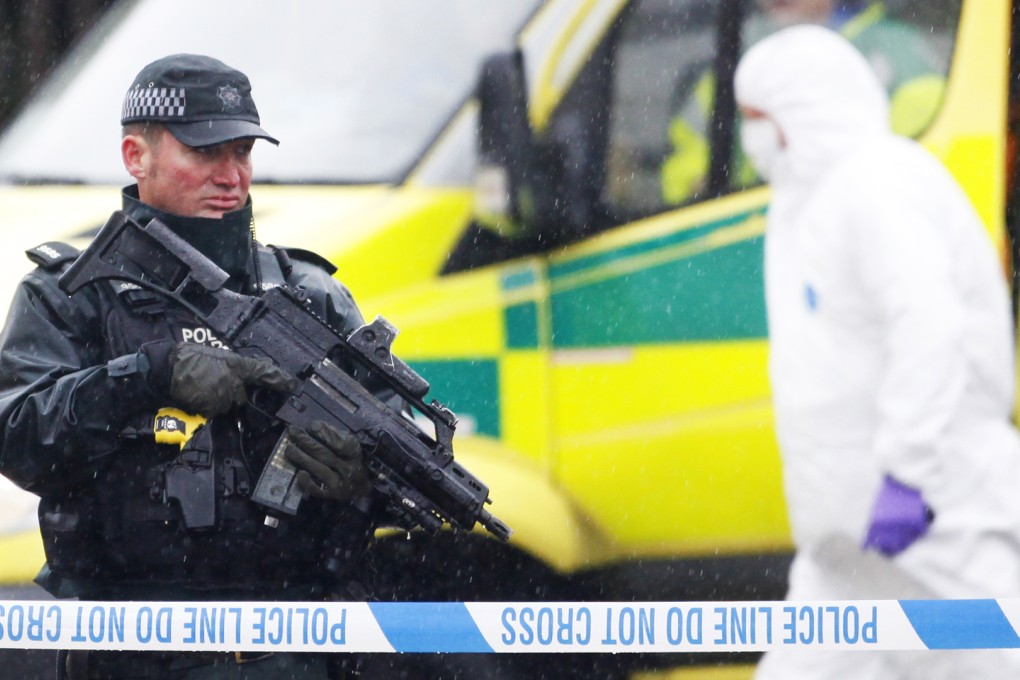Police and forensic officers at the scene of the fatal shooting of former senior IRA man Gerard "Jock" Davison in Belfast on Tuesday. Photo: AP