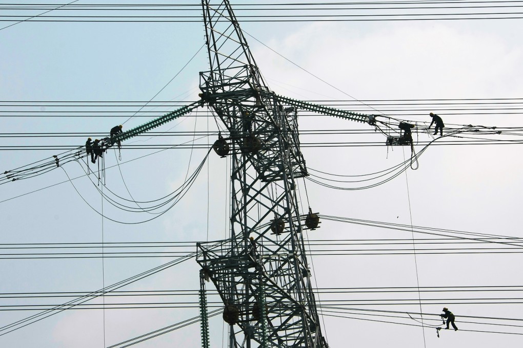 Technicians work on a power plant in Anhui. Photo: Xinhua