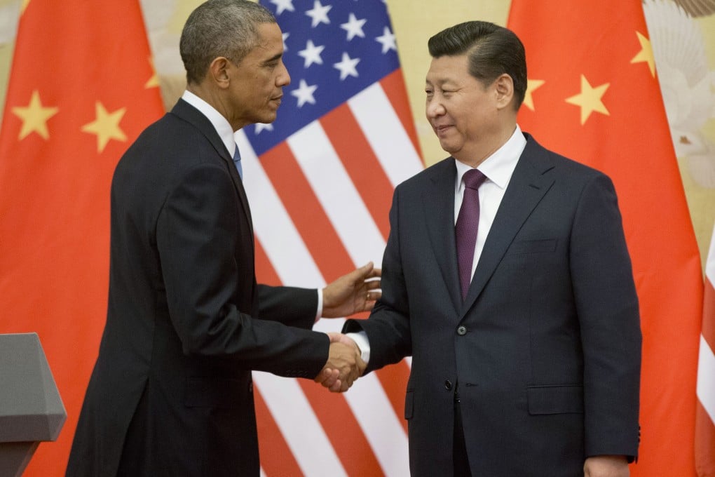 US President Barack Obama and Chinese President Xi Jinping shake hands after a meeting in Beijing last year. Both countries are still engaged in the 'great game' to advance their own interests as the two most powerful countries in the world. Photo: AP