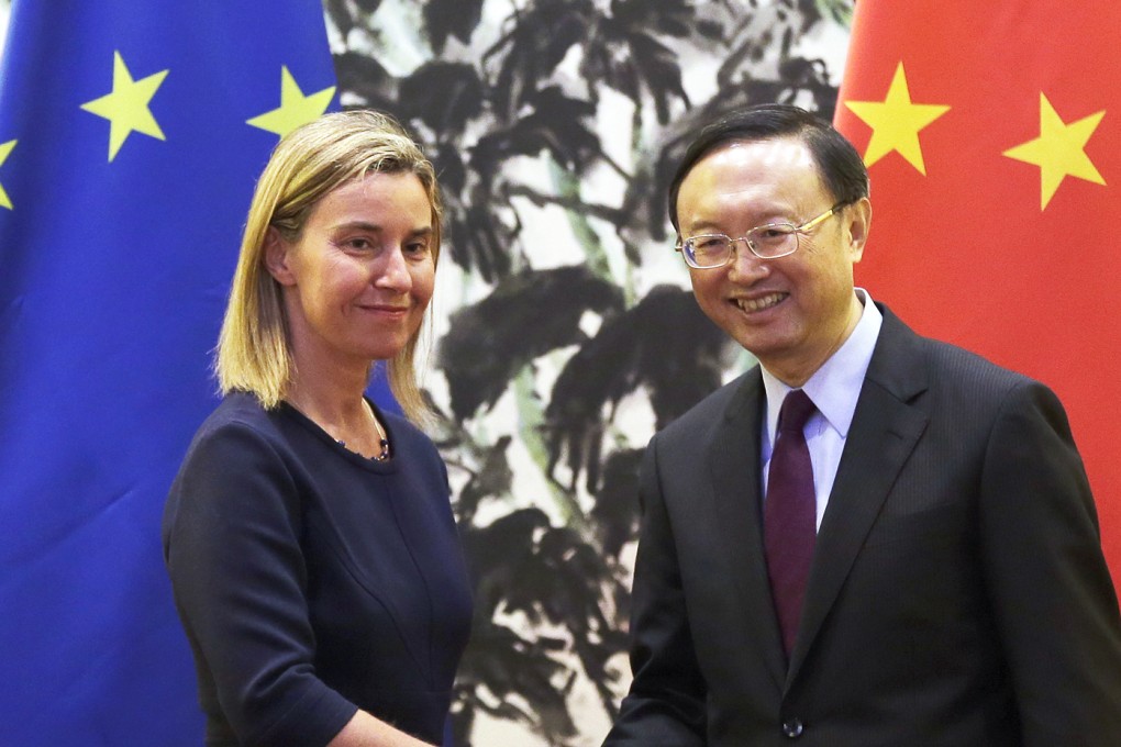 Federica Mogherini (left), the European Union foreign policy chief, shakes hands with Yang Jiechi, China's top foreign policy official, after Tuesday's talks in Beijing. Photo: AP