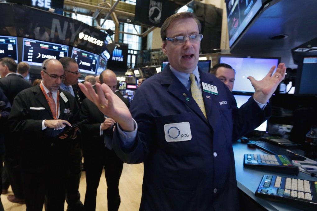 A trader gestures on Wall Street in New York after US stocks ended sharply lower over weak US trade data. Photo: AP