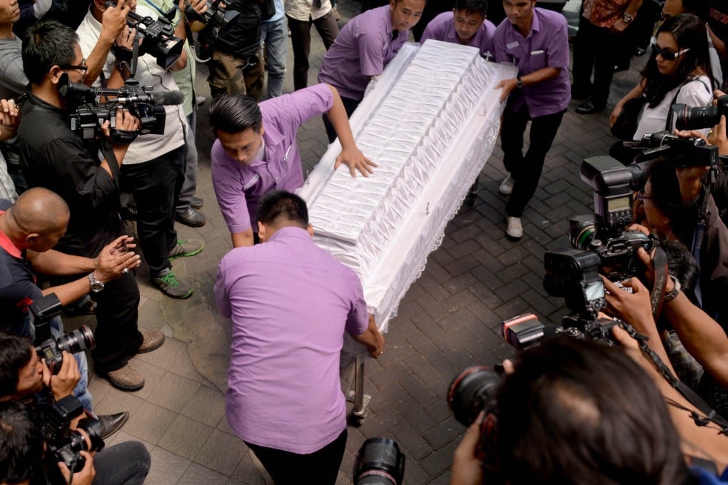 Hospital morgue employees carry the coffin of executed Brazilian drug convict Rodrigo Gularte at the hospital morgue in Jakarta. Photo: AFP