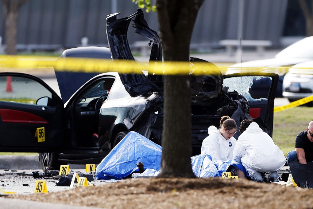FBI crime scene investigators document the area around two deceased gunmen and their vehicle outside the Curtis Culwell Center in Garland, Texas on May 4, 2015. Photo: AP