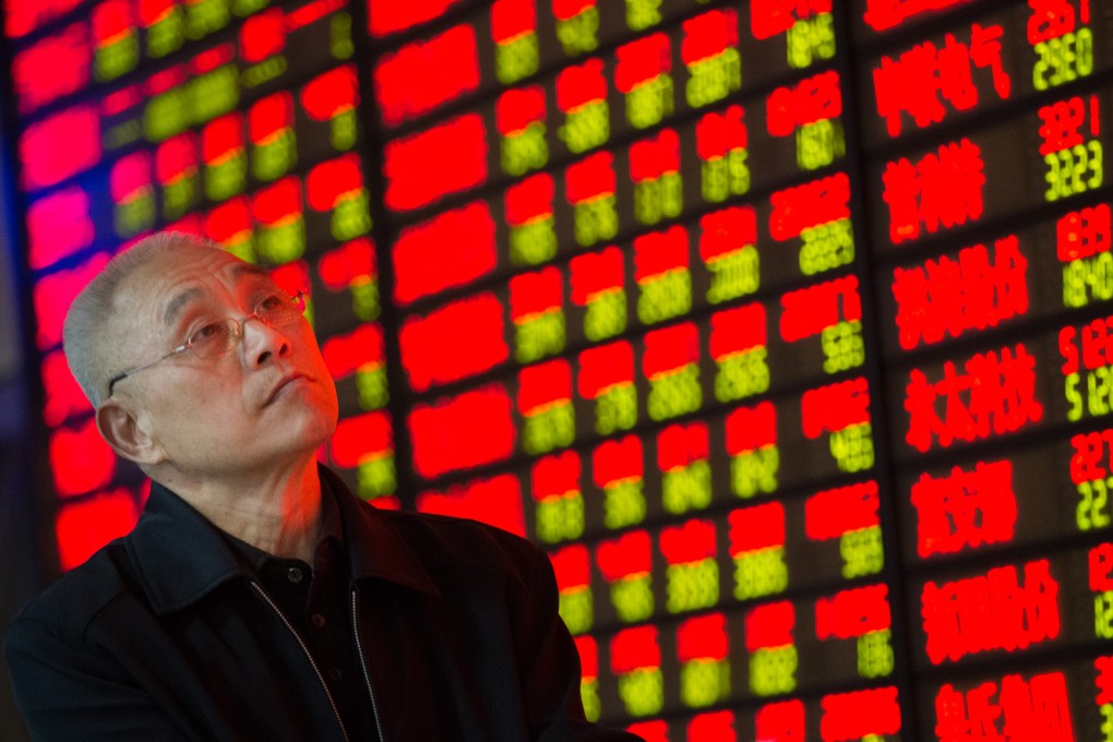 An investor in Jiangsu province watches stock prices on an electronic board as the effects of the rallying market has not yet delivered significant support to China's economy. Photo: Xinhua