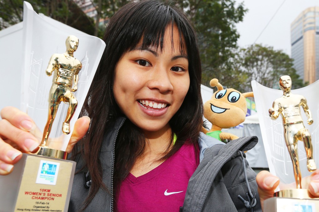 Christy Yiu with 10km and women's overall trophies from the Hong Kong Marathon last year. Photo: David Wong