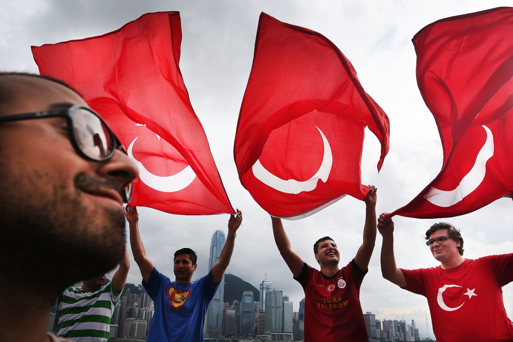 Turkish expats living in Hong Kong gather for a peaceful protest at the clock tower in Tsim Sha Tsui in support of protests in Istanbul against a public park being turned into a shopping mall in 2013. Photo: Sam Tsang