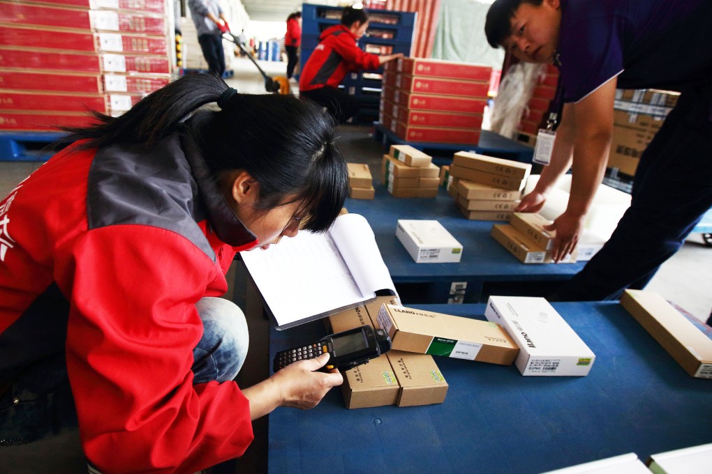 Workers check packages at a JD.com warehouse in Shanghai. Innovative companies, such as e-commerce firms, are key job sources for new university graduates. Photo: Bloomberg