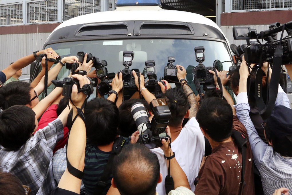 Zheng Xingwang, who was arrested when he tried to leave Hong Kong on Sunday, leaves Kwun Tong Court yesterday. Photo: Sam Tsang