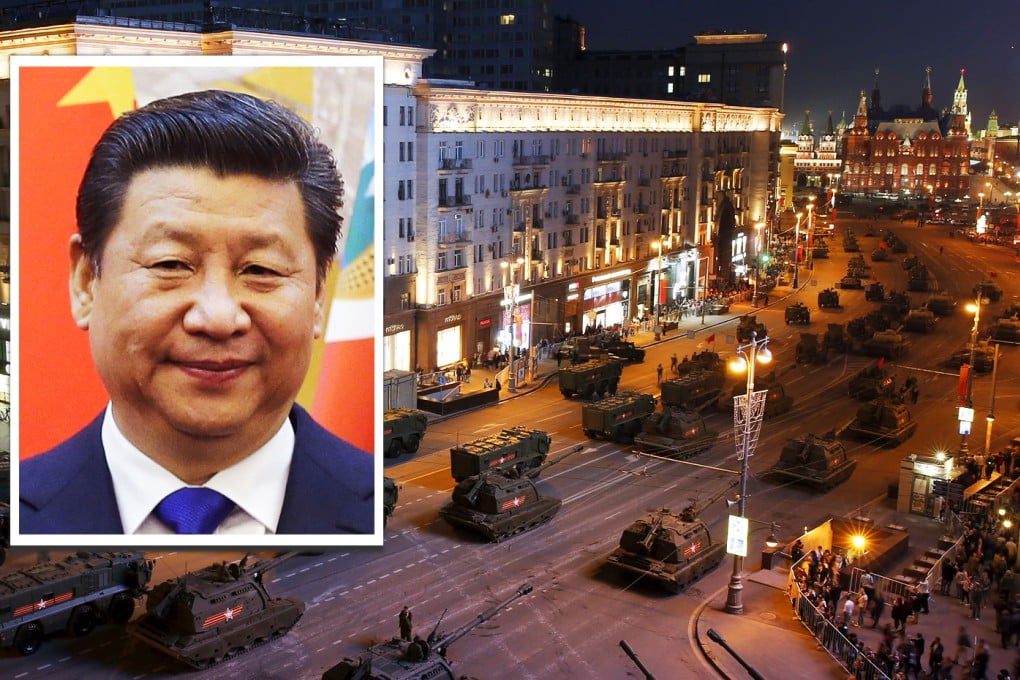 Russian military vehicles are seen in Tverskaya street before a rehearsal for the Victory Day parade, with the Kremlin towers (right) seen in the background, in central Moscow, Russia. Inset is Chinese's president Xi Jinping. Photos: Reuters, AP