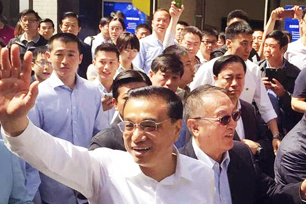 The new e-commerce guidelines came as Premier Li Keqiang visited Beijing's Inno Way - a start-up street with more than 12,000 technology companies - to toast entrepreneurs for creating employment. Photo: SCMP Pictures