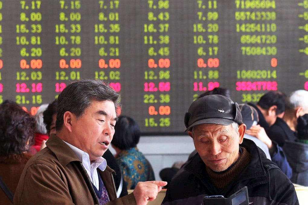 Chinese investors follow the performance of stocks as markets in Shanghai and Hong Kong recovered after Thursday's steep sell-off. Photo: Reuters