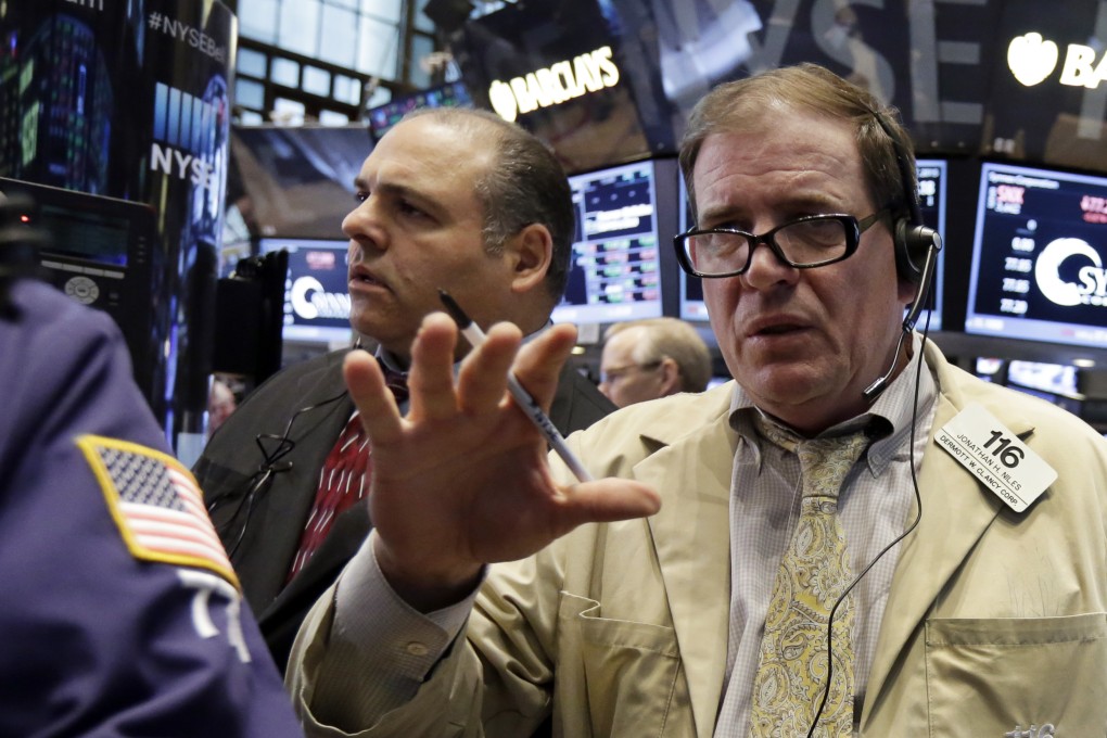 Floor traders get busy filing orders on Wall Street on Thursday as the rout in bond markets slows down, sparking a mild recovery in stocks in New York. Photo: AP