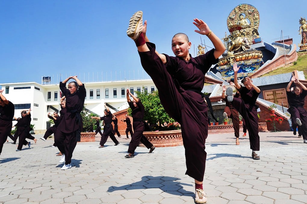 The 'kung fu nuns of Kathmandu' have have been training for about four years to react with speed and agility. Photo: AFP