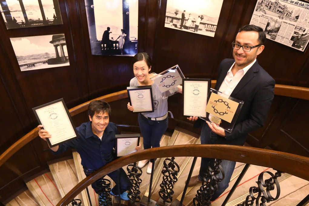 Cheng Kok-yin, Nora Tam and SCMP senior multimedia editor Silvio Carrillo show their awards yesterday. Photo: SMP