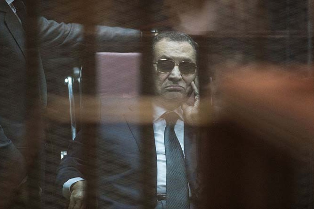 Egypt's former President Hosni Mubarak is seen inside the defendants' cage at court in Cairo on Saturday. Photo: Xinhua