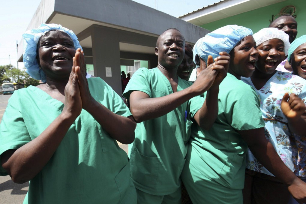 Medical staff at St Joseph's Catholic Hospital in Monrovia celebrate the announcement that Liberia is now considered Ebola free.Photo: EPA