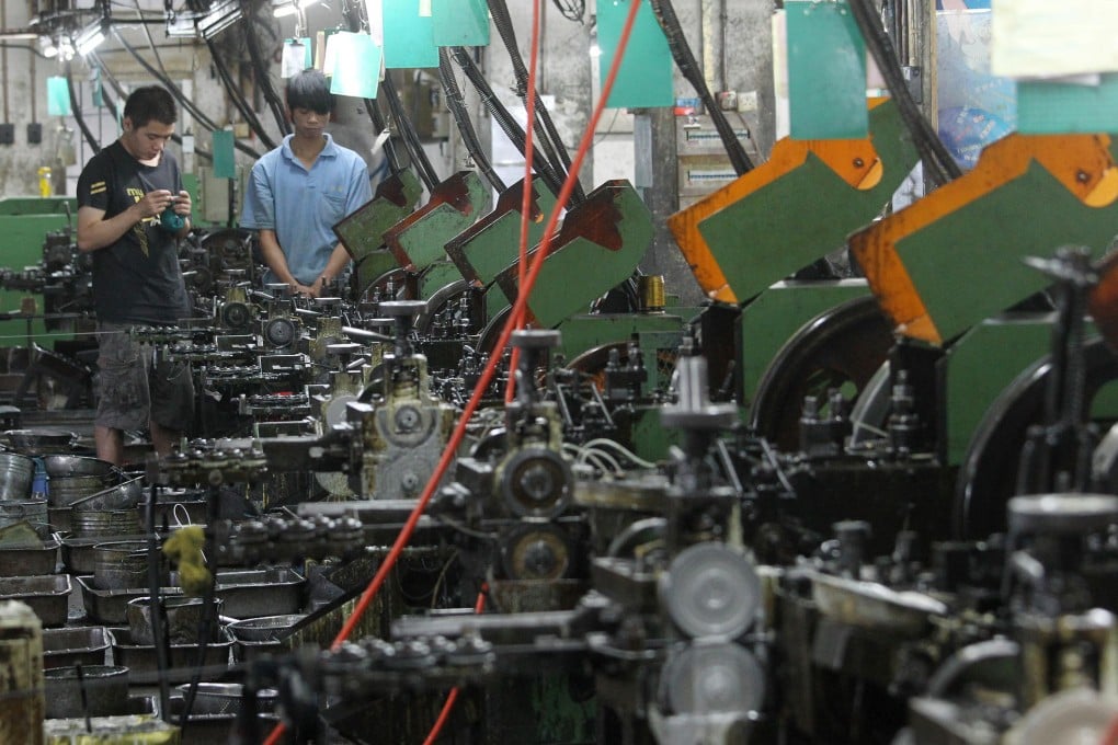 Dongguan factory workers make around 3,000 yuan a month, not much more than what they could earn back in their home province. Photo: May Tse