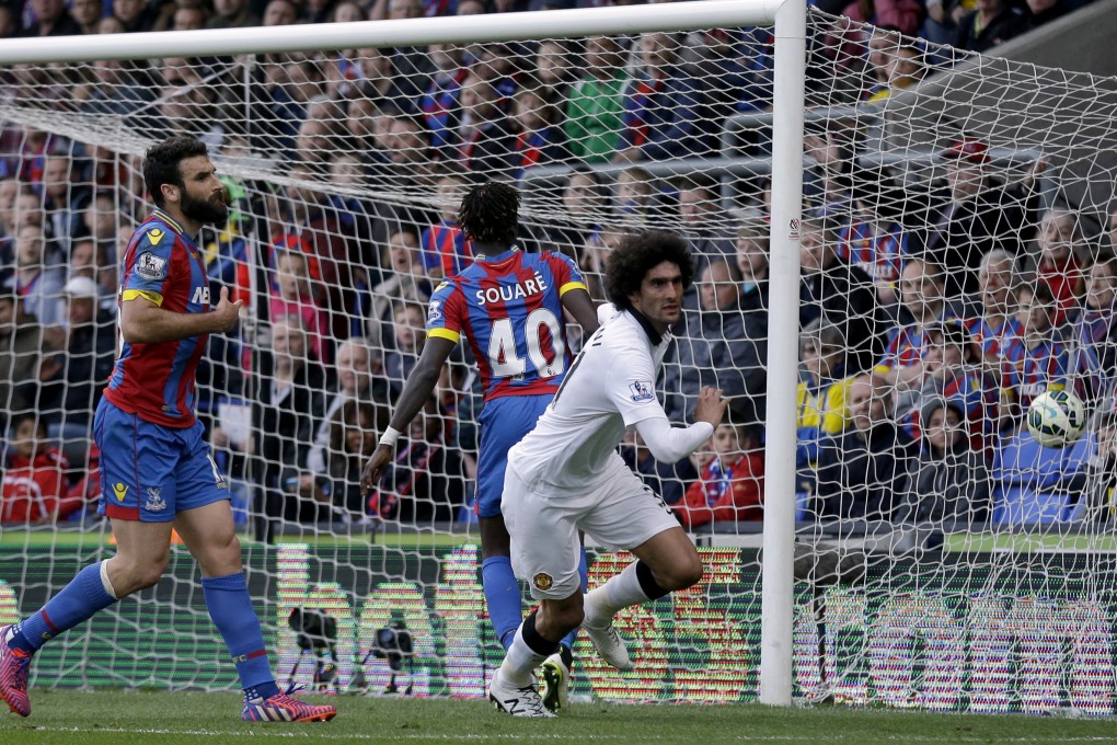 Manchester United's Marouane Fellaini celebrates scoring his side's second goal against Crystal Palace. Photo: AP