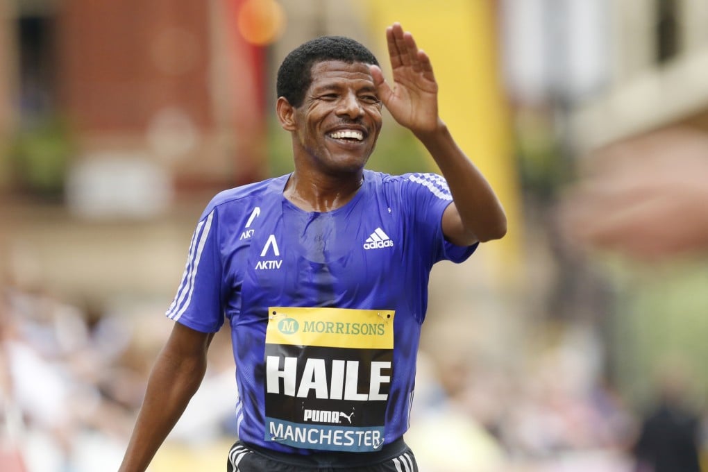 Ethiopian great Haile Gebrselassie crosses the finish line at the end of the Great Manchester Run. He later announced his retirement. Photo: Reuters