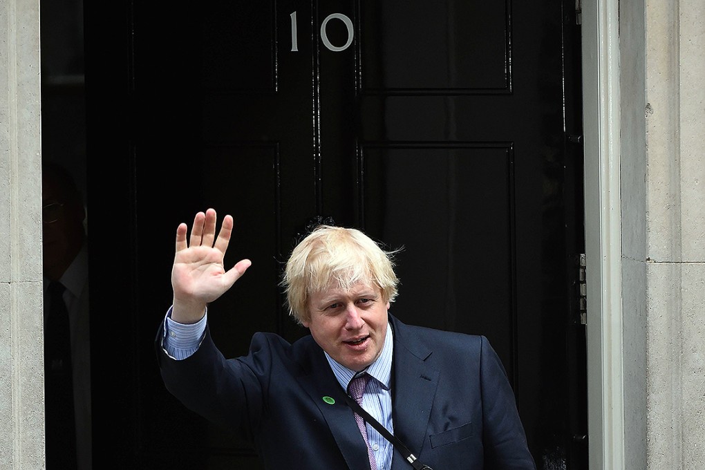 London Mayor and newly-elected Conservative member of parliament Boris Johnson waves as he arrives for a meeting at 10 Downing Street in London. Photo: AFP