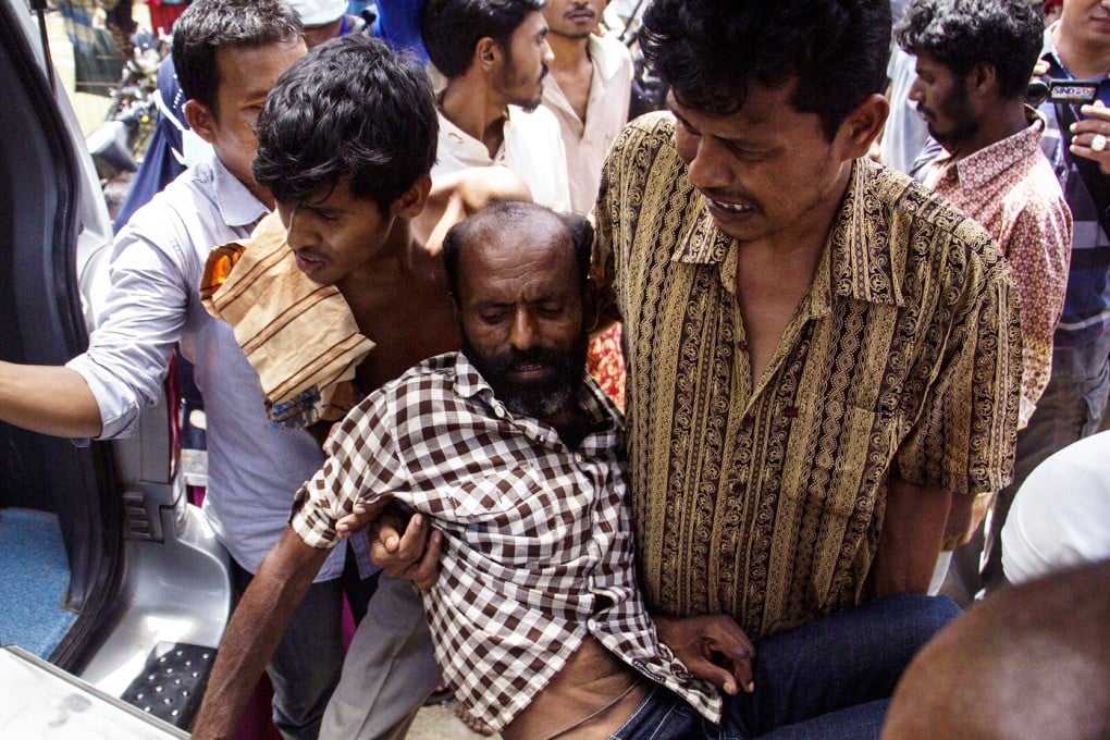 A Rohingya Migrant is brought to a hospital after being rescued, in Matang Raya Village, North Aceh, Indonesia. Photo: EPA