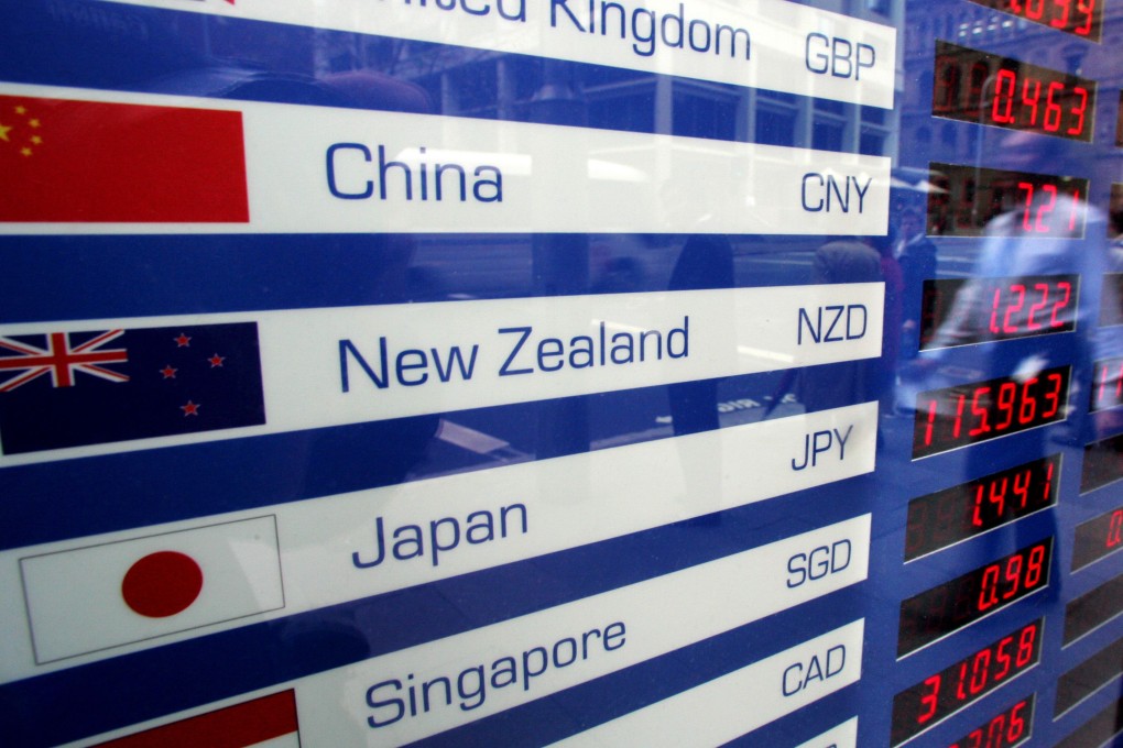 A foreign currency exchange trading board shows the Chinese yuan, as traders said the currency was stable after the sixth interest rate cut in three months was announced by Beijing on Sunday. Photo: Reuters