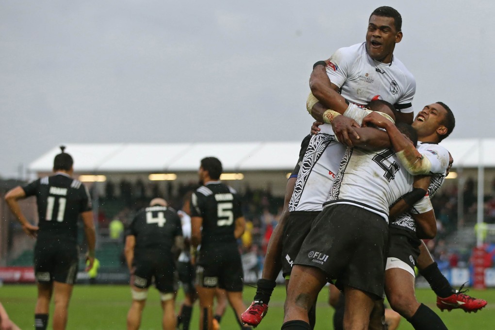 Fiji's players celebrate after beating New Zealand in the final at the Glasgow Sevens. Photos: AFP