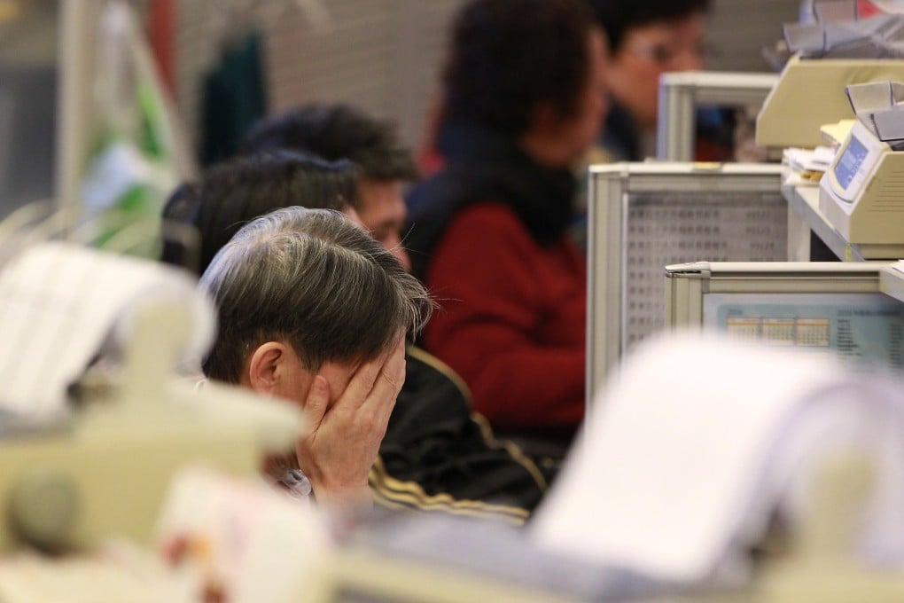 A trader rubs his face in the Hong Kong stock market as China tries to manage a rallying equities market as a financial risk. Photo: Dickson Lee