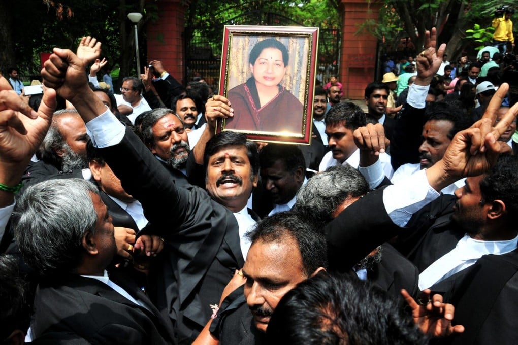 Former chief minister of Tamil Nadu Jayalalithaa Jayaram's lawyers celebrate after she was acquitted in the corruption case.Photo: EPA
