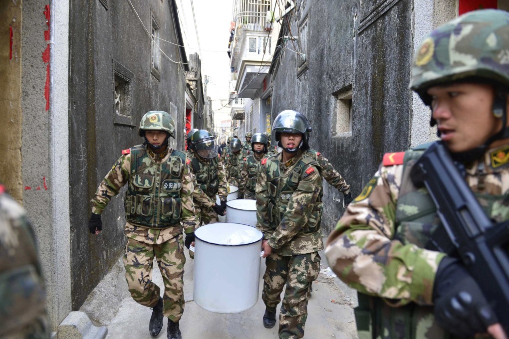 Paramilitary police pictured in December during raids on methamphetamine factories in Guangdong province. Three tonnes of the drug were found in one village. Photo: Reuters
