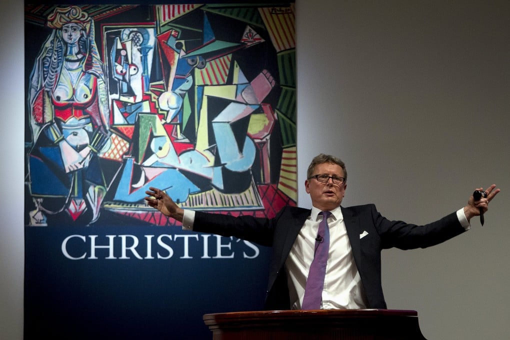 Auctioneer Jussi Pylkkanen calls for final bids before dropping the gavel as he sells Pablo Picasso's "Women of Algiers (Version O)" for a world record price on Monday. Photo: Reuters