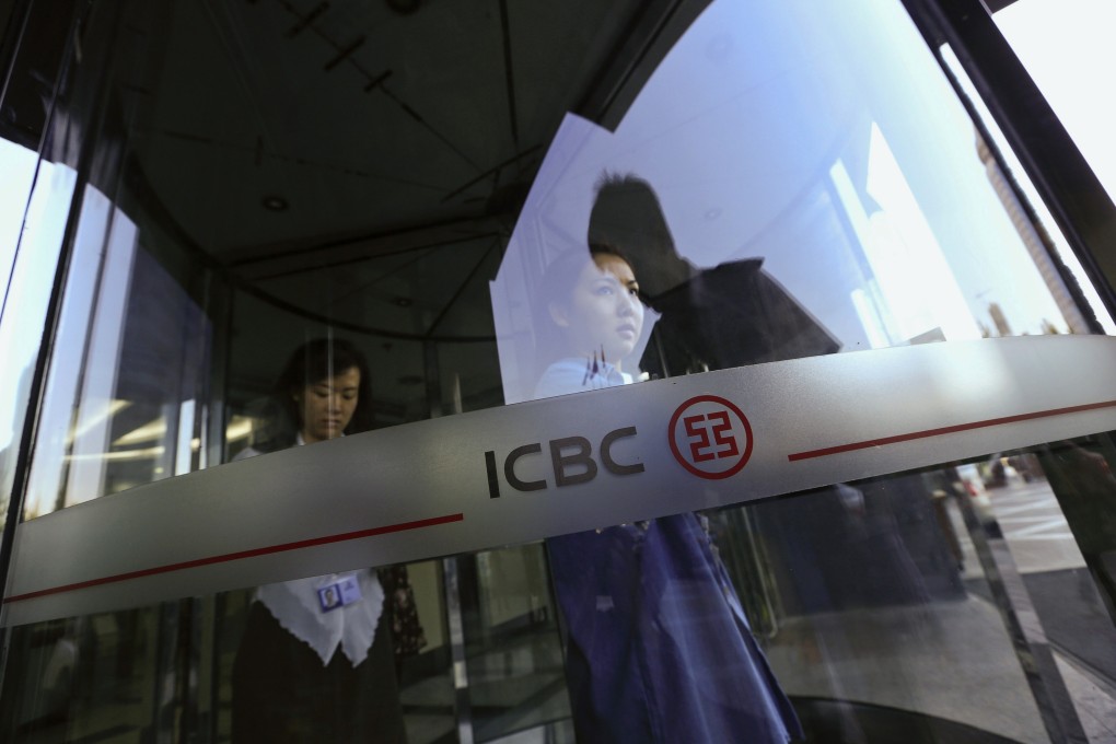 Customers exit a bank in Beijing as Fitch Ratings warned on Wednesday against the growing risks to Chinese banks of margin lending to investors to buy stocks in the country's sizzling stock market. Photo: Bloomberg