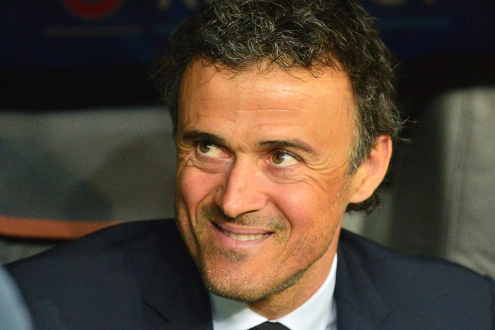 Luis Enrique smiles on Barca's bench. Photo: EPA