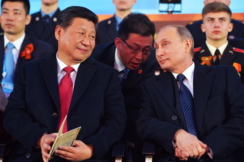 Russian President Vladimir Putin (front right) and Chinese President Xi Jinping (front left) attend a concert called 'The Roads of Great Victory' in Red Square in Moscow. Photo: EPA