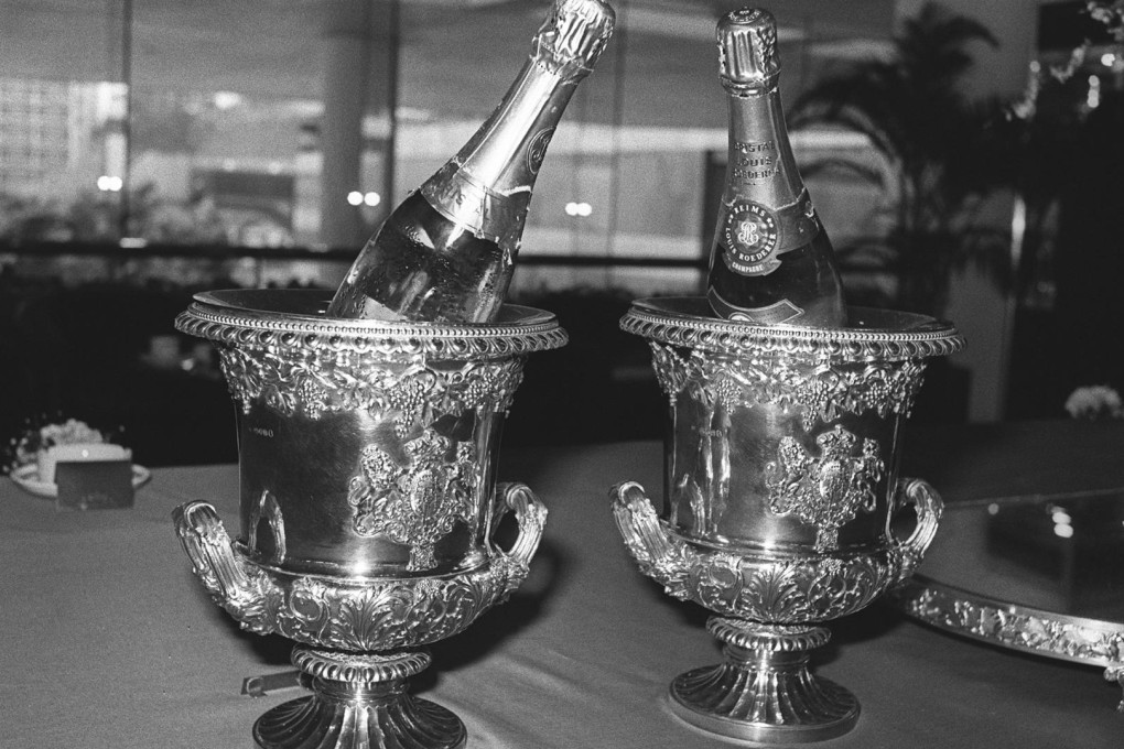 Above and below: corporate gifts have ranged from the silver-gilt champagne bucket to high-quality wines. Photos: SCMP