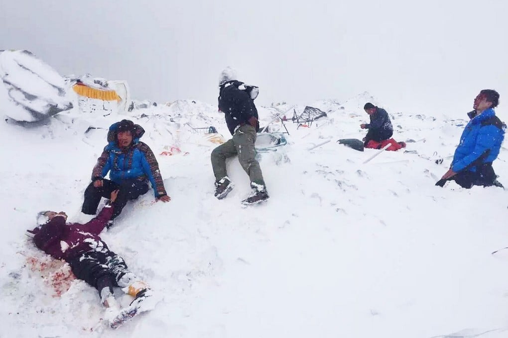 Teacher Ada Tsang (second from left) sits up in the aftermath of the first rush of snow, with the Belgian on the far right.