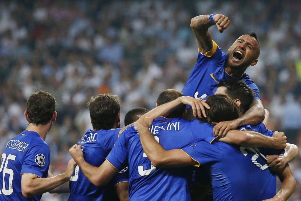 Juventus' Alvaro Morata celebrates scoring with Arturo Vidal and team mates. Photo:  Reuters