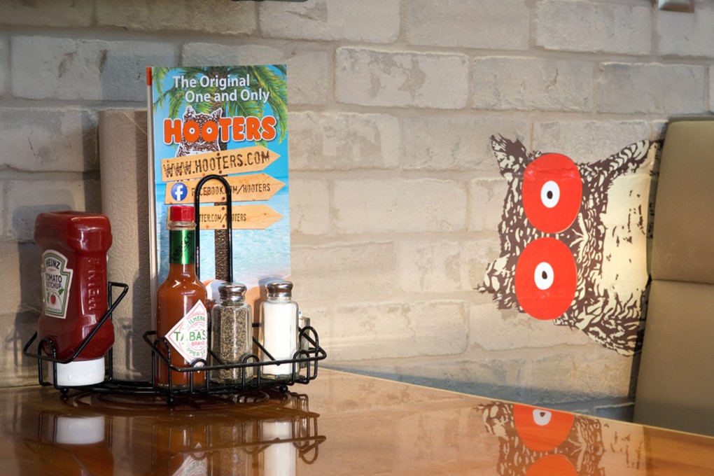 Hooters and Double D hamburger restaurants announced plans to open in Hong Kong.