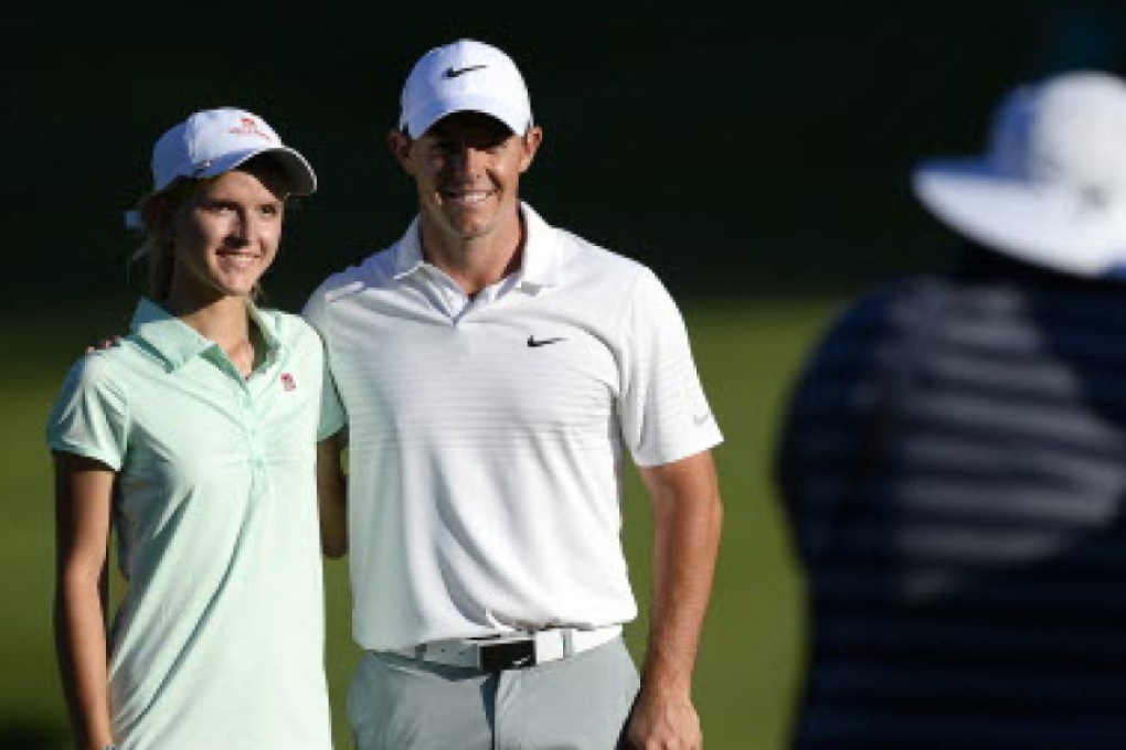 Rory McIlroy with Grace Vaughan, a 16-year-old with a blood disorder who won an essay contest to partner him at Quail Hollow. Photo: TNS