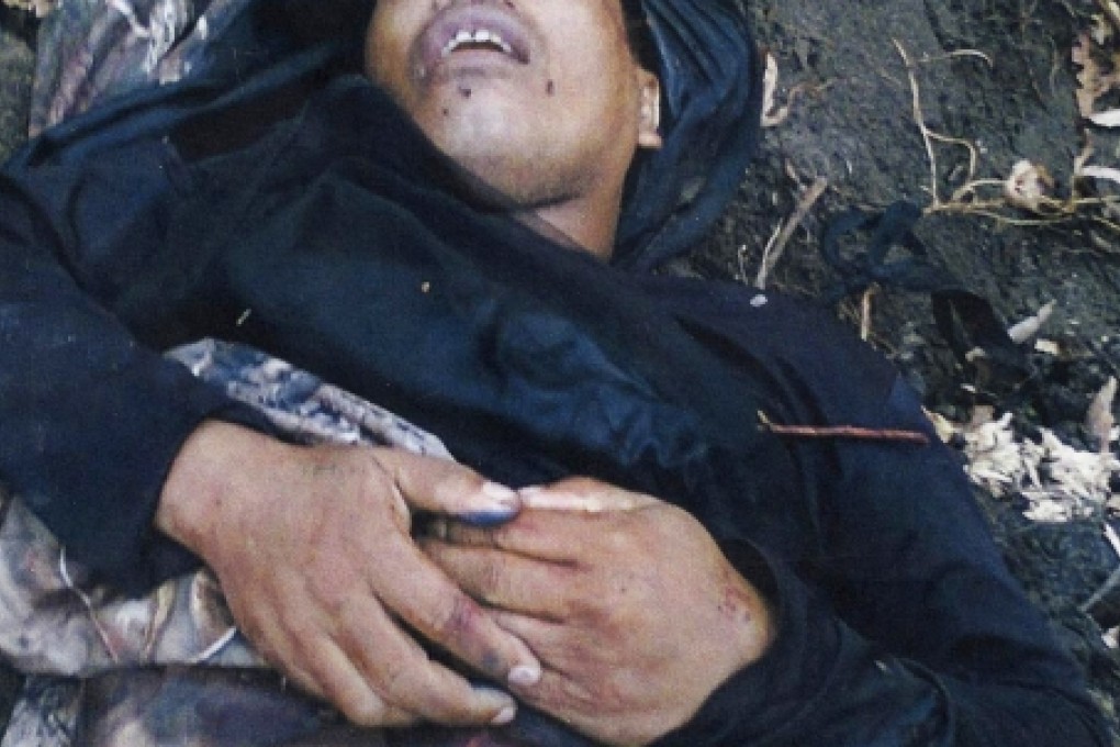 The body of wanted terrorist Abdul Basit Usman. Photo: AFP