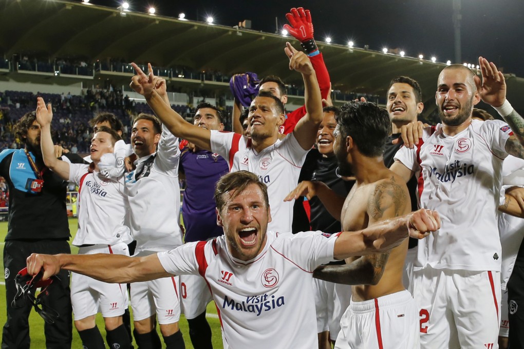 Sevilla celebrate reaching the final again. Photo: Reuters